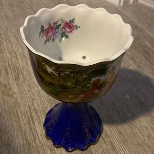 Very pretty English pedestal bowl. Blue base and gilt with pictures on inside
